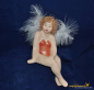 Preview: Engelfrau sitzend rot (Figur 2) Höhe: 22 cm