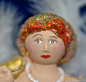 Preview: Engel sitzend molly mit Kopfbedeckung rot Höhe: 16 cm