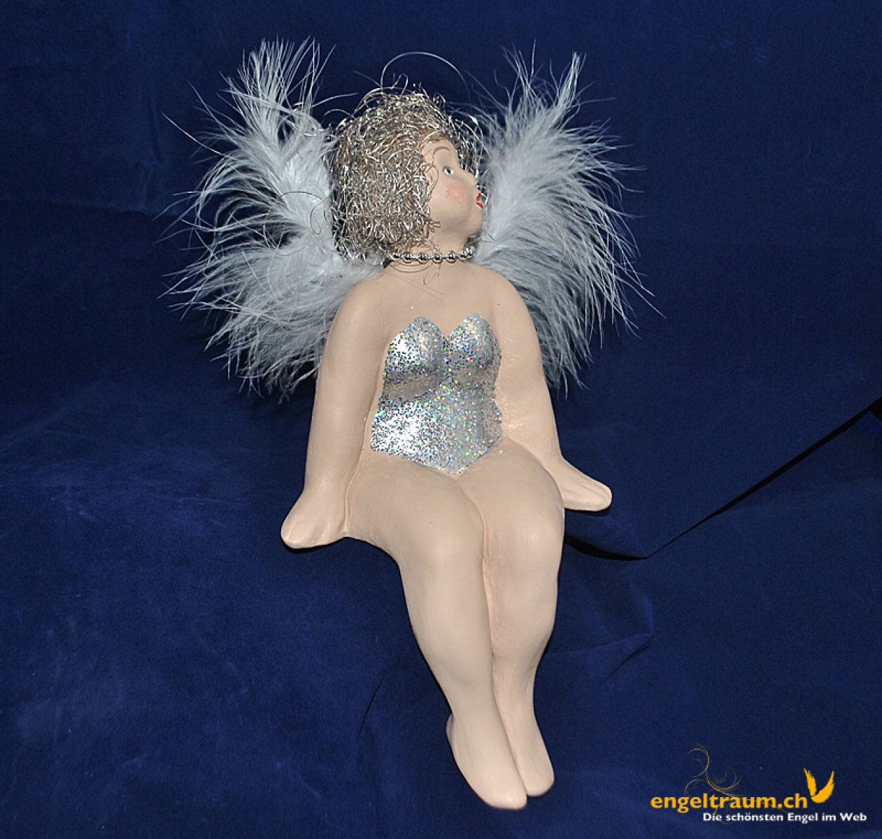 Engelfrau sitzend silber (Figur 1) Höhe: 22 cm