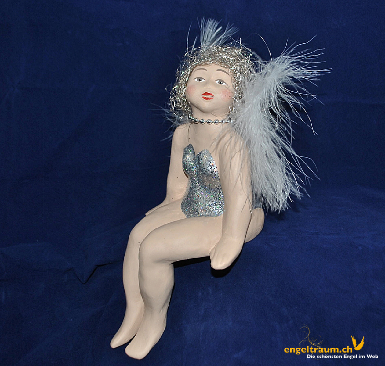 Engelfrau sitzend silber (Figur 1) Höhe: 22 cm