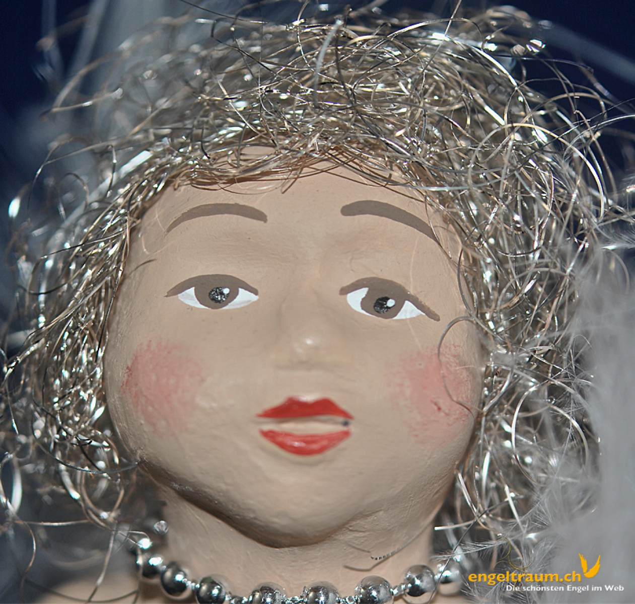 Engelfrau sitzend silber (Figur 1) Höhe: 22 cm