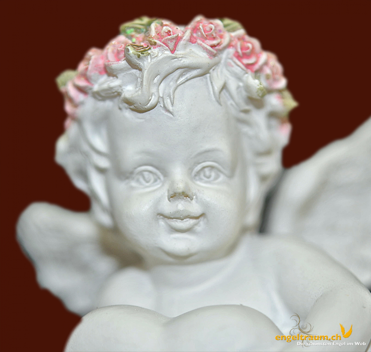 Engel liegend mit Herz und Blütenkranz (Figur 2) Höhe: 5 cm